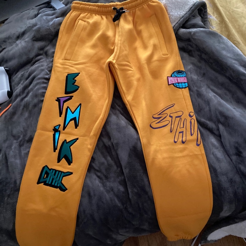 Yellow sweat pants. They are a size small and soft